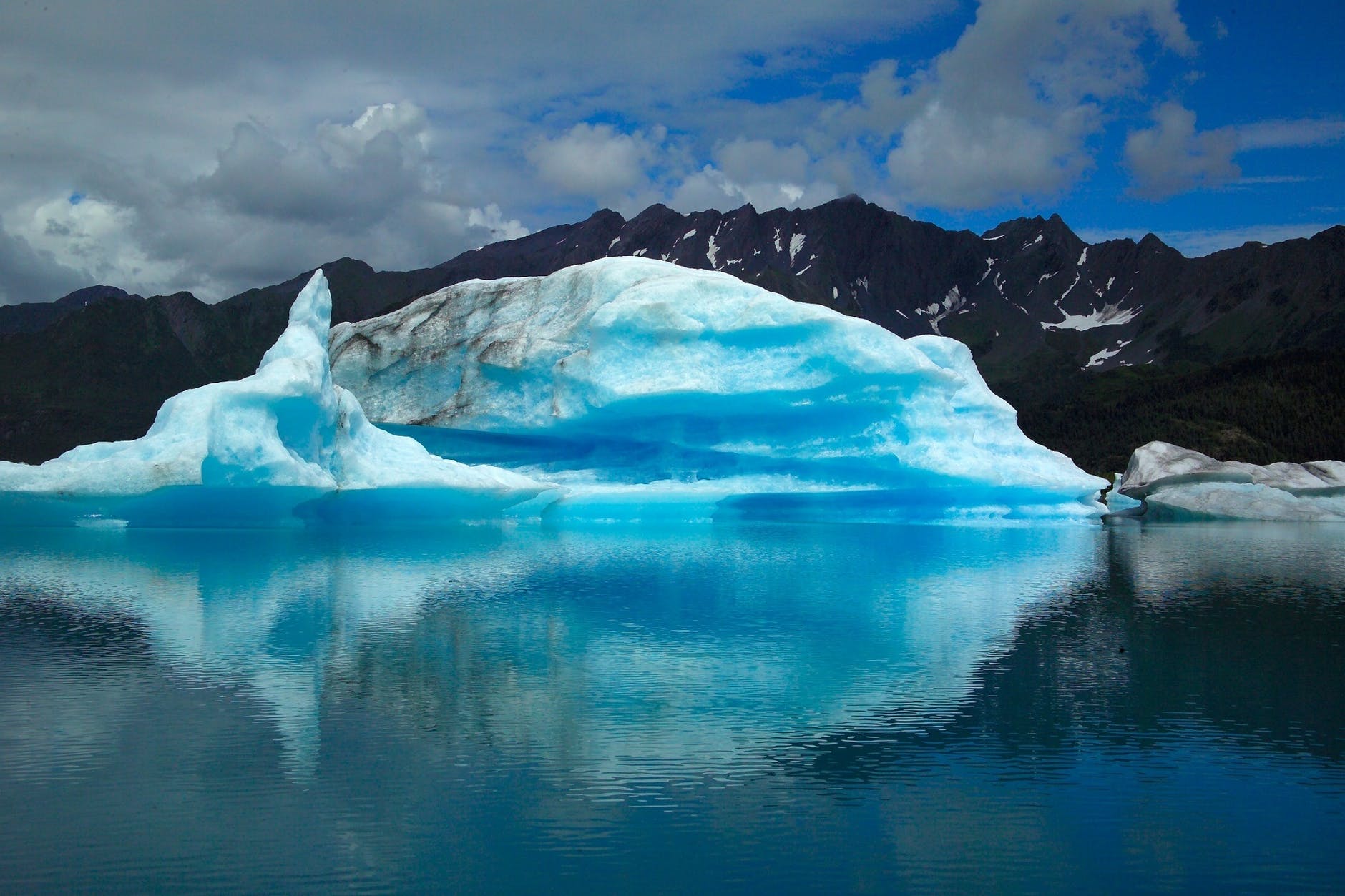 scenic view of frozen lake against blue sky