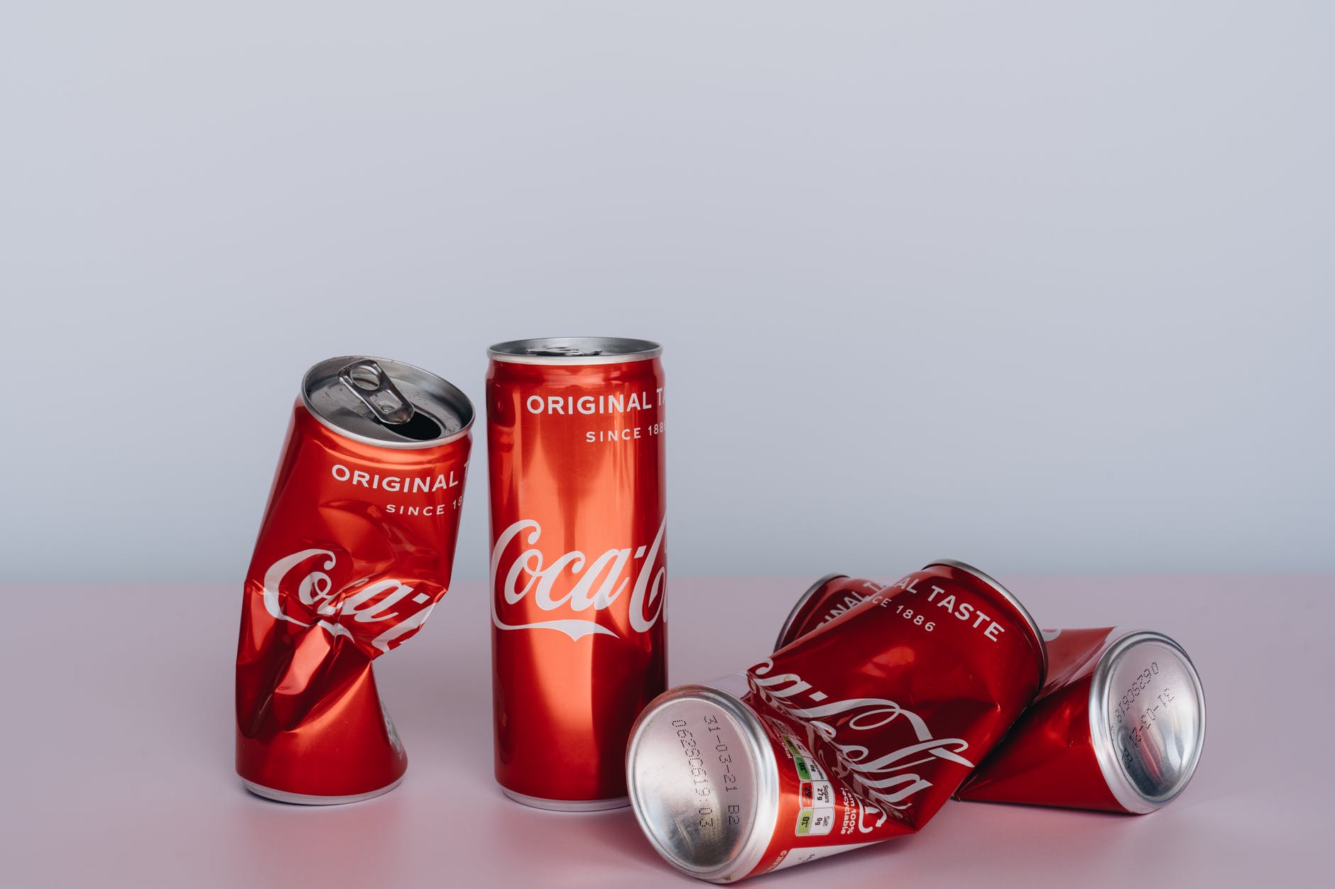 coca cola can on white table