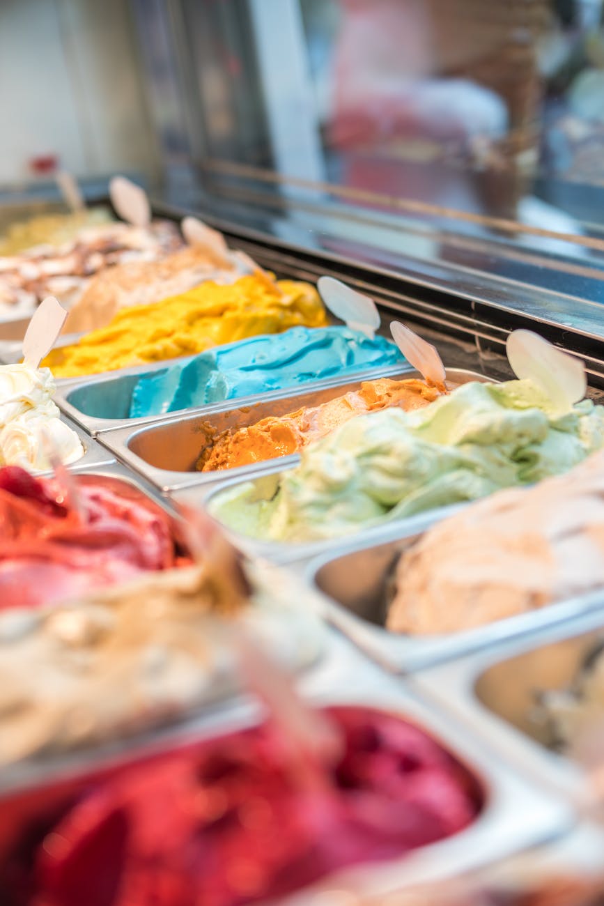 assorted flavor ice cream in display shelf selective focus photography